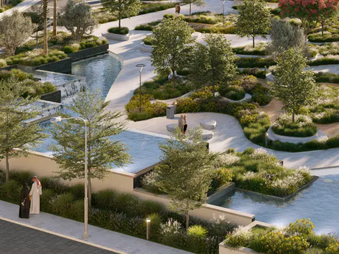 Water features at Prime, bordered by lush greenery and trees