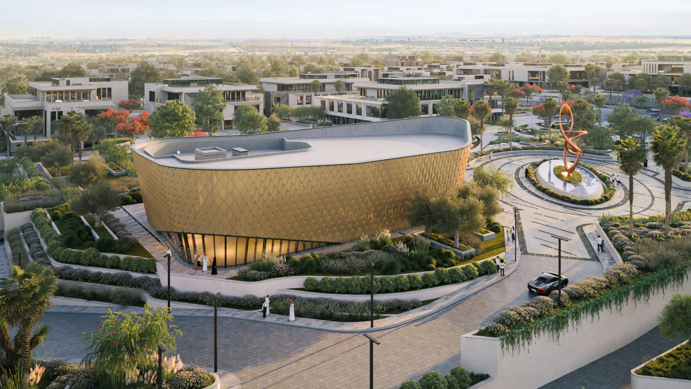 Daytime view of The Pavilion near King Saud University, surrounded by greenery and office buildings.
